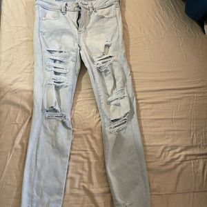 AE light wash heavy distressed Jeggings.